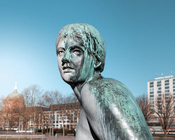 Statue of building against clear blue sky