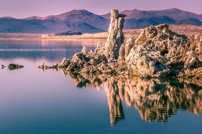 Scenic view of lake with mountain range in background