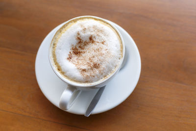 High angle view of cappuccino on table