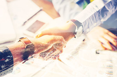 Double exposure of businessmen doing handshake