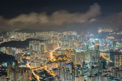 Aerial view of city lit up at night