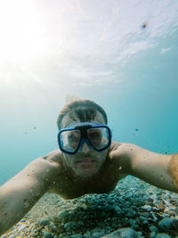 Portrait of man swimming in sea