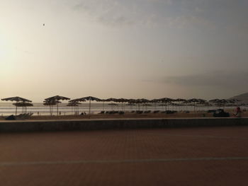 Scenic view of beach against sky during sunset