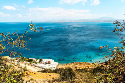 Scenic view of sea against cloudy sky