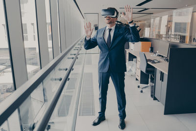 Low angle view of businessman using mobile phone