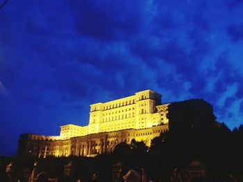 Low angle view of buildings against blue sky