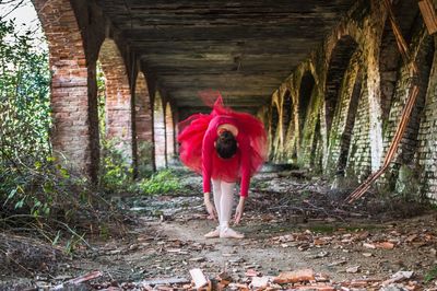 Full length of a man standing in red farm