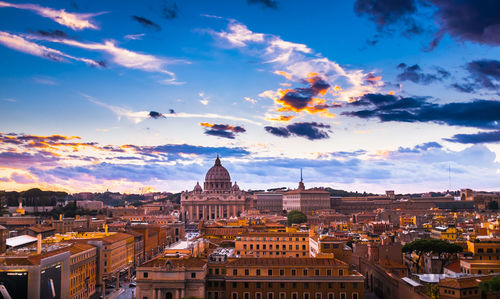 Cityscape against sky at sunset