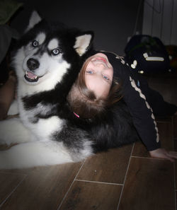 Portrait of young woman with dog