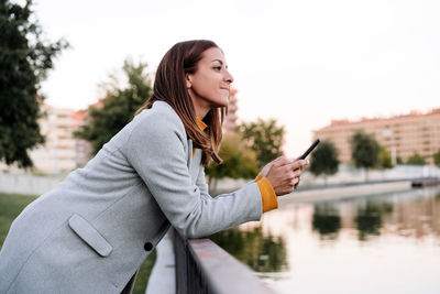 Young woman using mobile phone