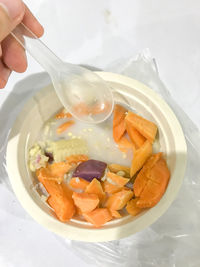 High angle view of person having food in plate