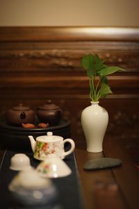 Close-up of tea served on table against sea during sunset