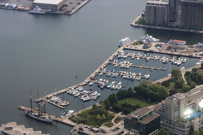 Aerial view of boats moored at harbor in river