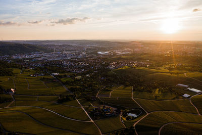 High angle view of soccer field against sky during sunset