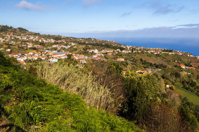 Aerial view of townscape against sky