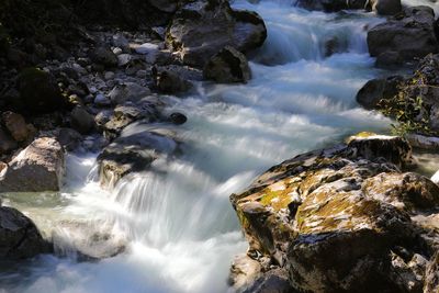 Scenic view of waterfall in sea