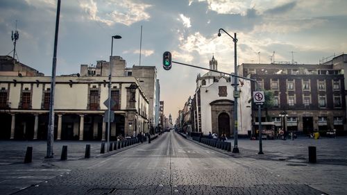 Road in city against sky