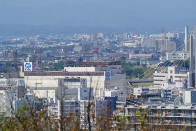 High angle view of buildings in city against sky