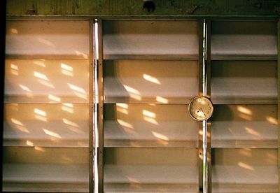 Close-up of illuminated lighting equipment hanging on wall