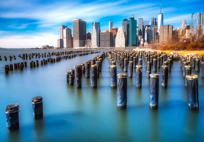 Panoramic view of sea and city against sky