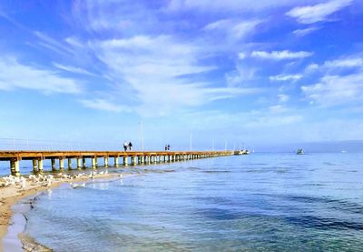 Pier over sea against sky