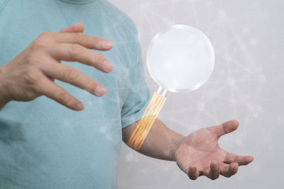 Close-up of hands holding ball