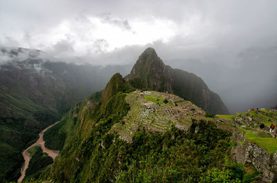 Scenic view of mountains of a machu picchu against cloudy sky