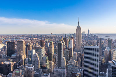 Modern buildings in city against sky