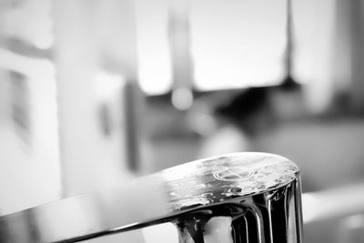 Close-up of metallic railing on table