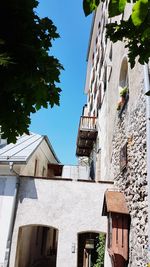 Low angle view of buildings against blue sky