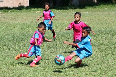 Children playing on soccer field