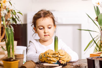 Portrait of boy eating food on table