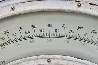Close-up of old weight scale