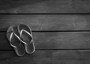 High angle view of shoes on wooden table