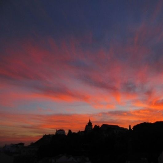 sunset, silhouette, sky, orange color, scenics, beauty in nature, tranquil scene, cloud - sky, tranquility, mountain, dramatic sky, nature, idyllic, building exterior, built structure, architecture, cloud, dusk, landscape, outdoors