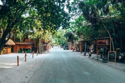 Restaurants and shops on both sides of an empty road near beach