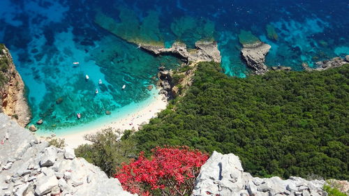 High angle view of rocks by sea