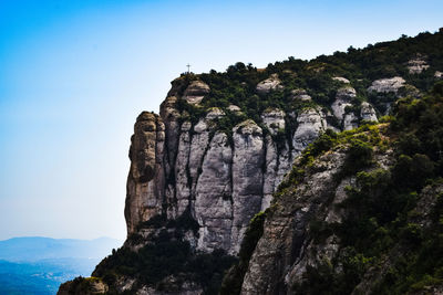 Low angle view of rock formation against sky