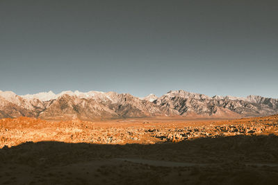 Scenic view of desert mountains against clear sky