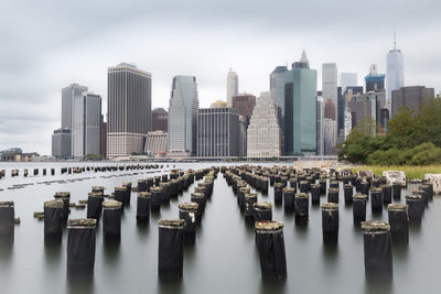 View of skyscrapers against cloudy sky