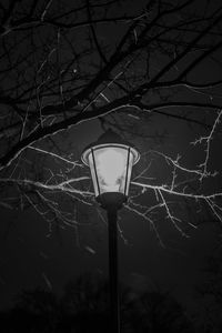 Low angle view of illuminated street light against sky at night