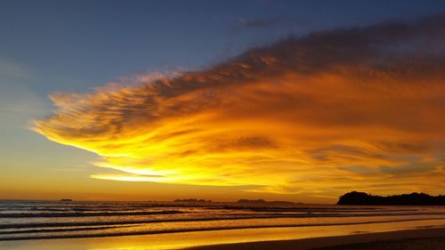 Scenic view of sea against romantic sky at sunset