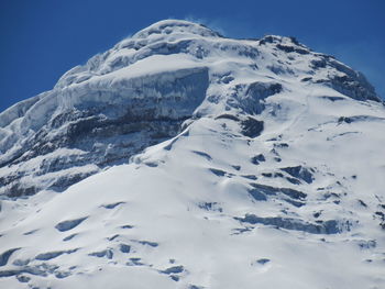 Scenic view of snow covered mountain against sky