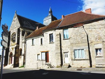 Low angle view of church against blue sky