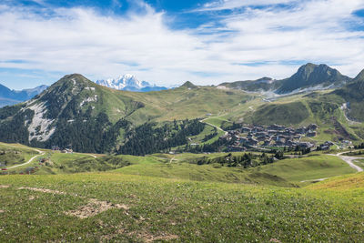 Scenic view of landscape and mountains against sky