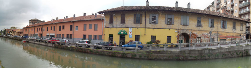 Boats in canal with buildings in background