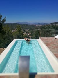 Swimming pool against blue sky