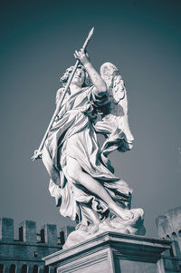 Low angle view of statue against sky