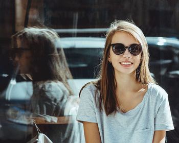 Portrait of young woman in sunglasses