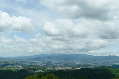 Aerial view of landscape against cloudy sky